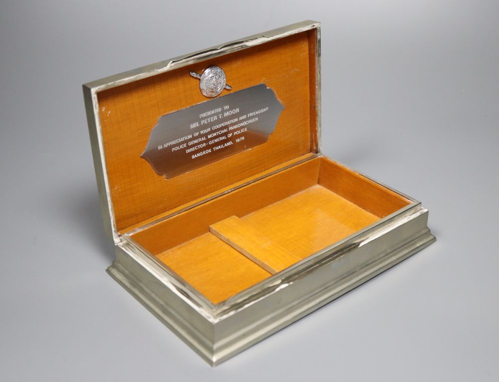 Two silver cigarette boxes, a silver cigarette case and Thai white metal cigarette box, largest 18.7cm.